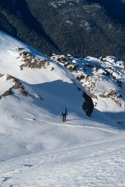 Rick after chopping through a small cornice, standing on the summit ridge of dder Mountain